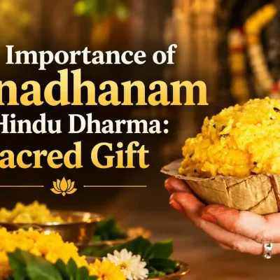 Devotees being served traditional meals on banana leaves as part of Annadhanam in a Hindu temple.