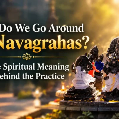 Devotee performing pradakshina around a Navagraha shrine in a Hindu temple
